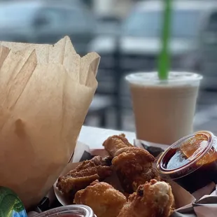 Fries, wings with the spicy sauce on the side and salted caramel milk shake