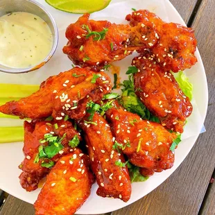 Korean BBQ Wings w/ gochujang pepper sauce, sesame seeds, buttermilk ranch | $11