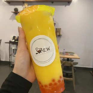 Passion fruit slushy with strawberry popping boba