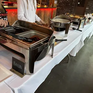 a buffet table with food being served