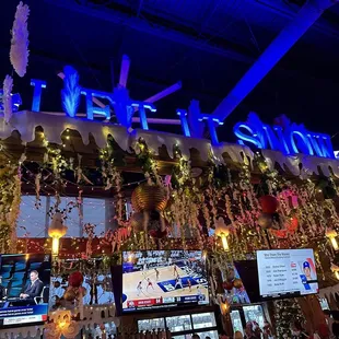the inside of a bar decorated for christmas