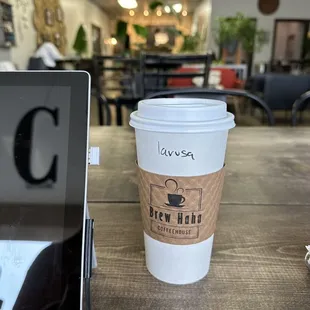 a cup of coffee and a laptop