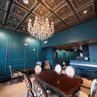 a dining room with a chandelier