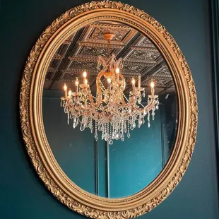 a chandelier in a mirror