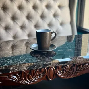 a cup of coffee on a table
