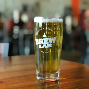 a glass of beer on a table