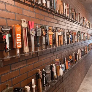 a wall full of beer taps