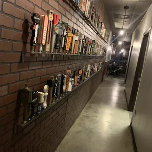 a long hallway with shelves of beer