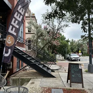 a coffee shop on the corner of a street