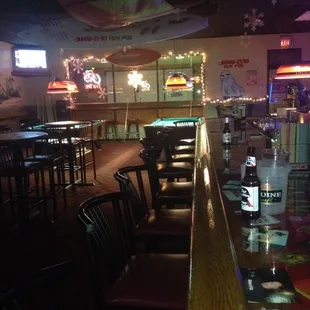 a bar with tables and chairs