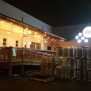 the outside of a beer shop at night