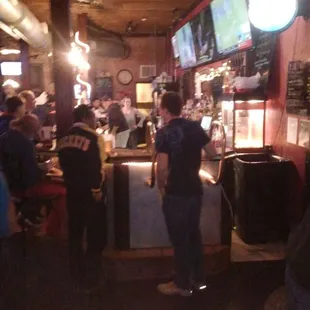 a crowd of people at a bar