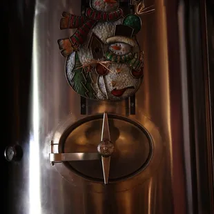 a snowman on a beer tank