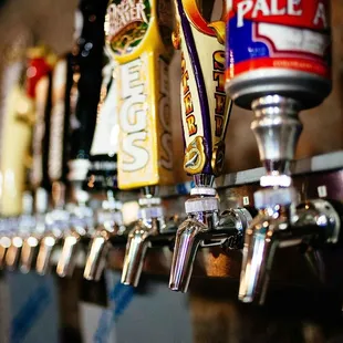 a row of beer taps