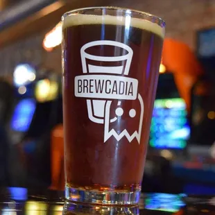 a pint glass on a bar