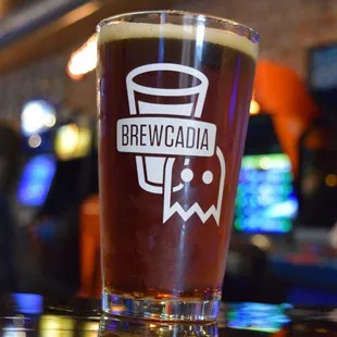 a pint glass on a bar