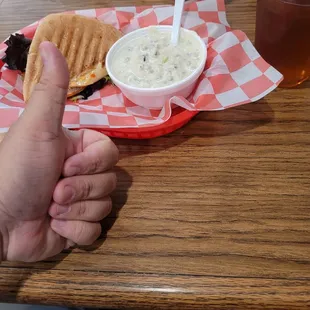Po boy and a wild rice chowder thing with an ice tea
