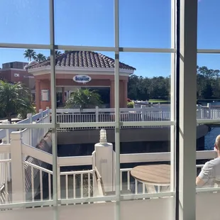 a woman sitting on a balcony