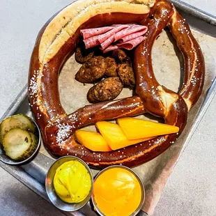 Pretzel with seasonal meats and cheese