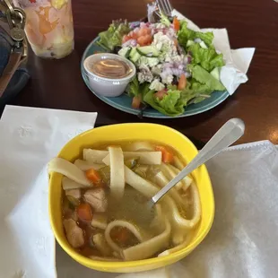 Soup and salad combo, plus fruit cup. Chicken salad (salad), and chicken noodle soup
