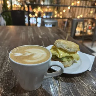 8oz oatmilk latte and a breakfast sandwich+avo