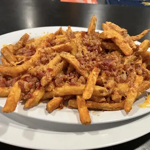 Bacon cheese fries- large portion! I think you can order them with cheddar or sleazy cheese. We opted for cheddar