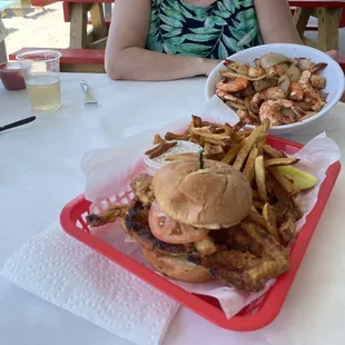 Steamed Shrimp with potatoes and onions, huge soft shell crab sandwich with the legs extending out of the bun.