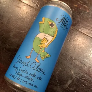 a can of beer on a wooden table