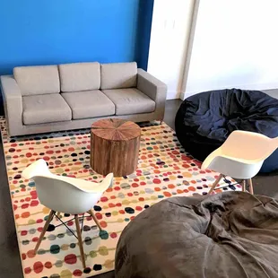Lounge space with whiteboard, couch and beanbags
