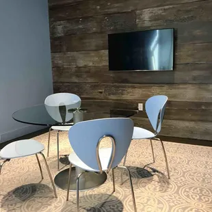 Modern conference room amenities with Mac Mini, Apple TV, speakerphone