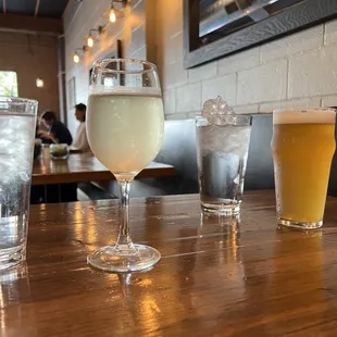 Trying new wine and beer. Hopefully the ice melts into our water lol.