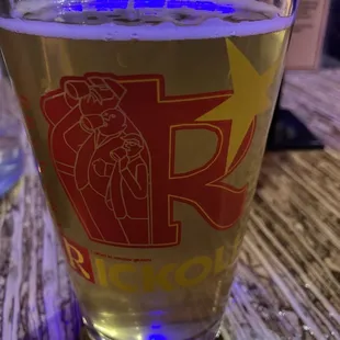 a pint of beer on a table