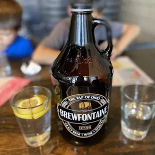 a bottle of beer and a glass of lemonade