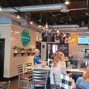 Brewfontaine sign and happy customers.