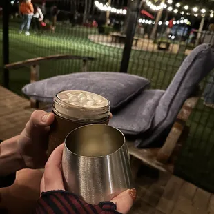 a person holding a drink