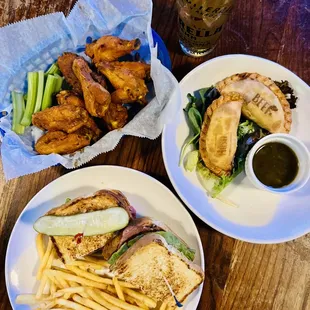 two plates of food and a glass of beer