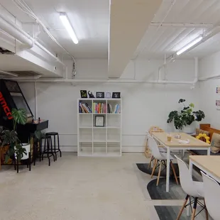 There's seats and tables and on the wall are photos of cute dogs and cats!