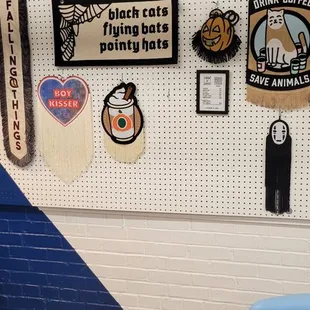 a wall with a variety of stickers on it