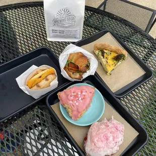 Breakfast sandwich, quiche, scone, croissant