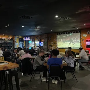 a large group of people sitting at tables