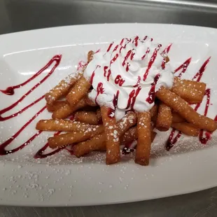 Funnel fries with cream and raspberry sauce