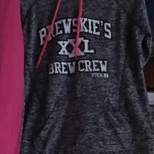 a hoodie hanging on a rack