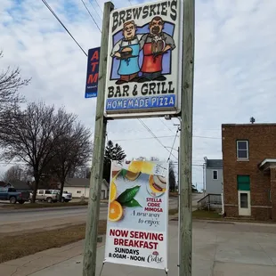 a sign for a bar and grill