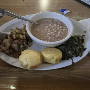 Ham and beans dinner with greens, corn bread, and fried potatoes