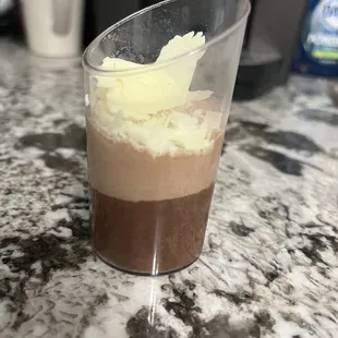 a dessert in a plastic cup