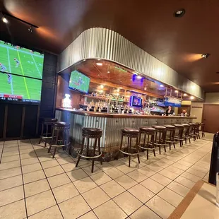 a sports bar with a large screen