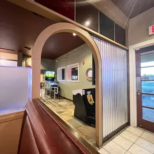 Middle  area seating area between burger restaurants and pizza place