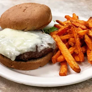Brewster burger with Swiss cheese on wheat bun with sweet potato fries
