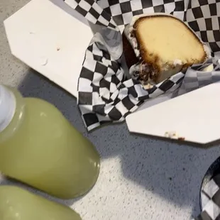 a sandwich in a checkered paper wrapper