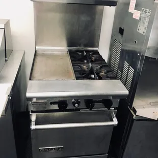 flat top griddle and open burner w/ oven. Great find! we don't come across these often. Perfect for a small kitchen or lunch truck!